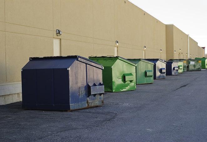 a large dumpster awaits materials from a renovation project in Bethel